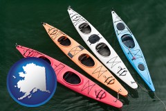 alaska map icon and four colorful fiberglass kayaks