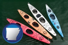 arkansas map icon and four colorful fiberglass kayaks
