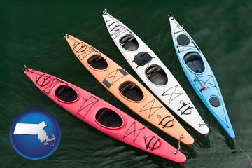 four colorful fiberglass kayaks - with Massachusetts icon