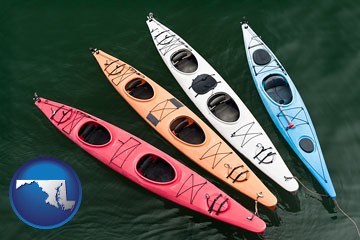 four colorful fiberglass kayaks - with Maryland icon