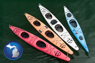 four colorful fiberglass kayaks - with Michigan icon