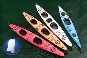 four colorful fiberglass kayaks - with Mississippi icon