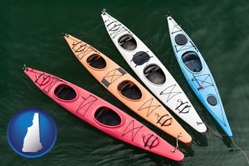 four colorful fiberglass kayaks - with New Hampshire icon