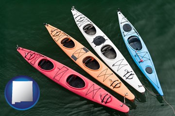 four colorful fiberglass kayaks - with New Mexico icon