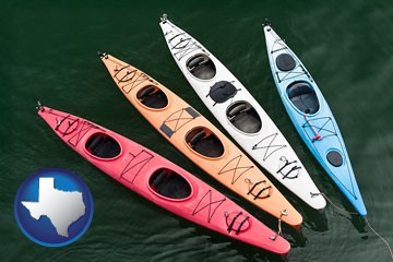 four colorful fiberglass kayaks - with Texas icon