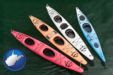 four colorful fiberglass kayaks - with West Virginia icon